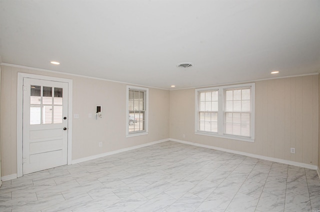 spare room with visible vents, marble finish floor, ornamental molding, recessed lighting, and baseboards