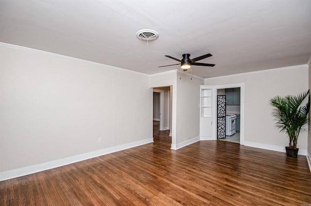 spare room with visible vents, ornamental molding, baseboards, and wood finished floors