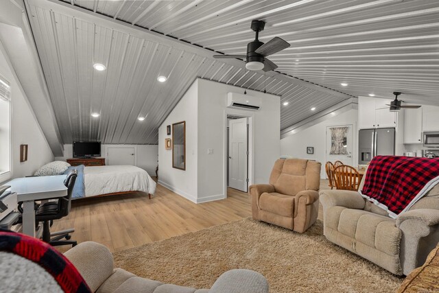 bedroom with light wood-style flooring, a wall mounted AC, lofted ceiling, and stainless steel fridge with ice dispenser