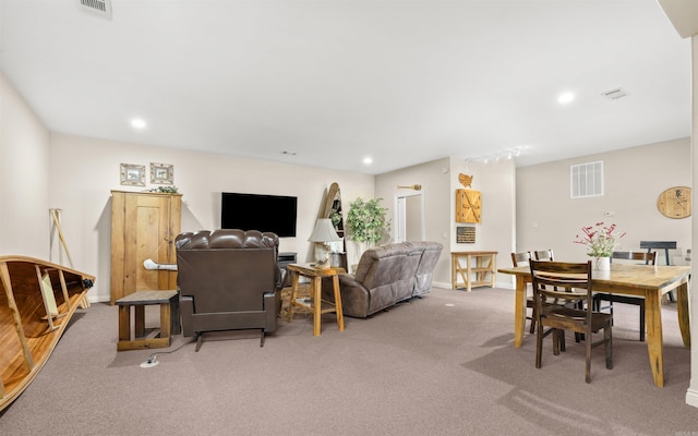 living area with recessed lighting, visible vents, baseboards, and carpet