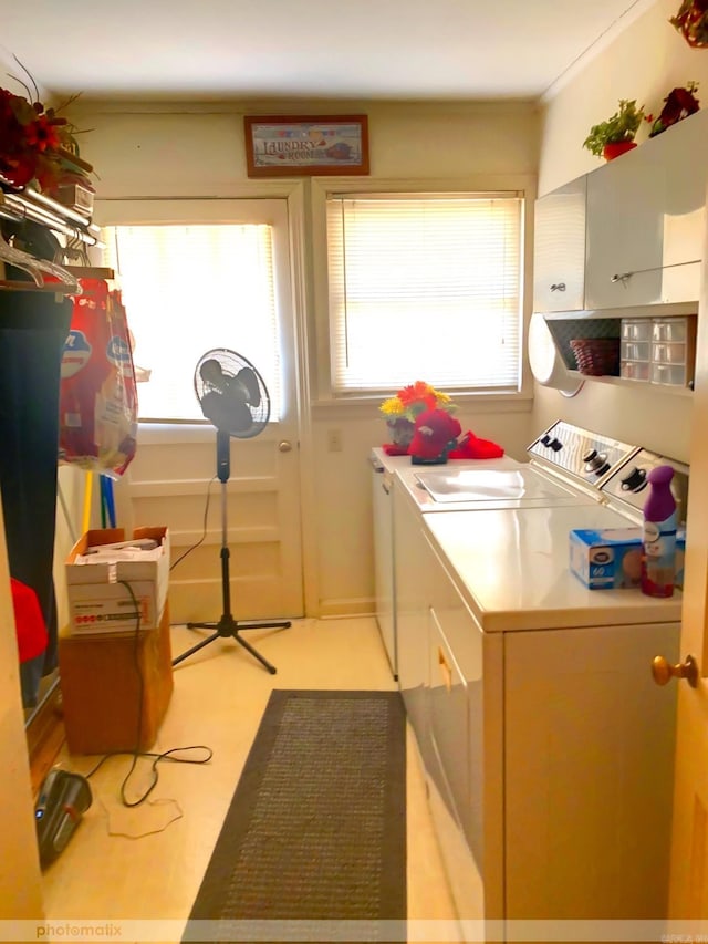 laundry room featuring separate washer and dryer and laundry area