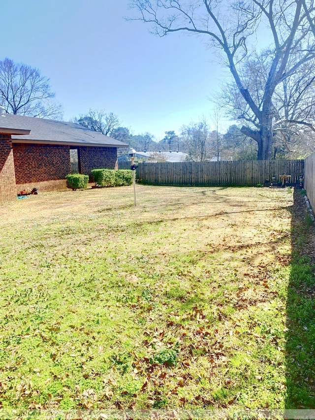 view of yard featuring fence