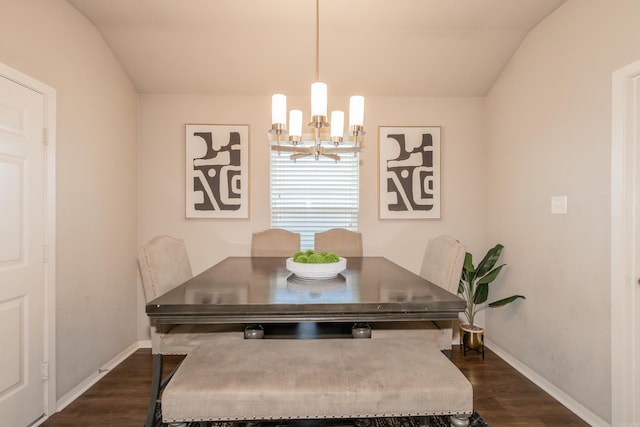 dining room with an inviting chandelier, baseboards, and dark wood-type flooring