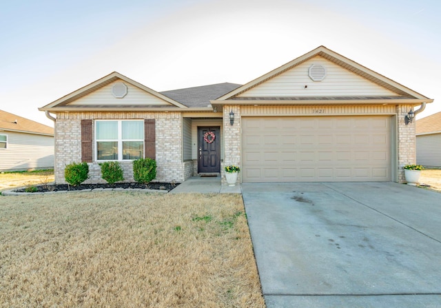 ranch-style house with brick siding, concrete driveway, a garage, and a front yard