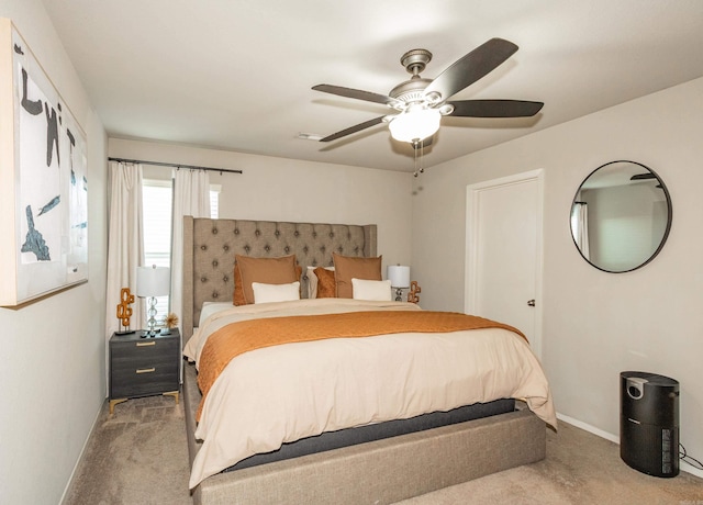 bedroom with carpet flooring, baseboards, and ceiling fan