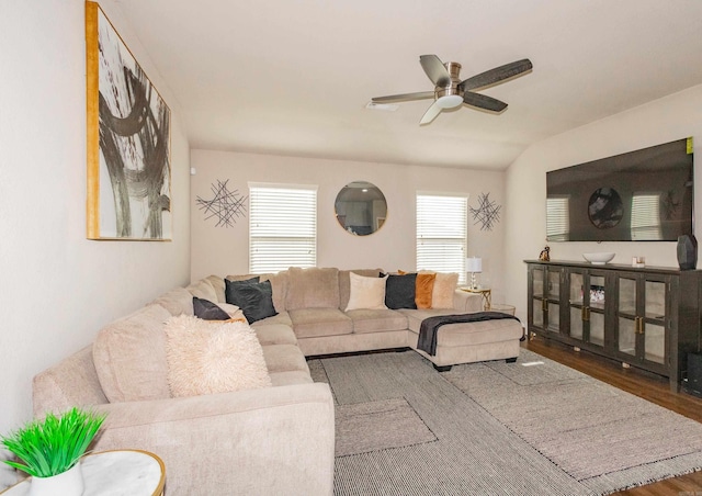 living area featuring a ceiling fan and wood finished floors