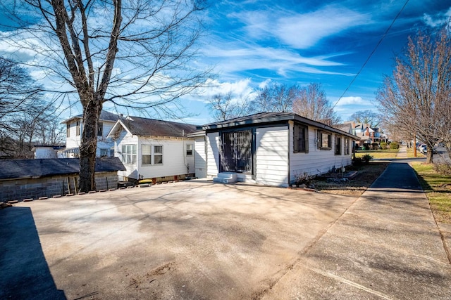 rear view of property featuring entry steps