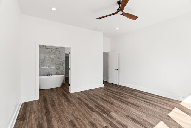 unfurnished bedroom featuring recessed lighting, baseboards, and dark wood-style flooring