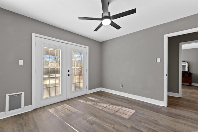 interior space with ceiling fan, french doors, baseboards, and wood finished floors