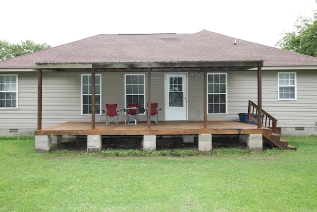 rear view of property with a wooden deck, a yard, roof with shingles, and crawl space