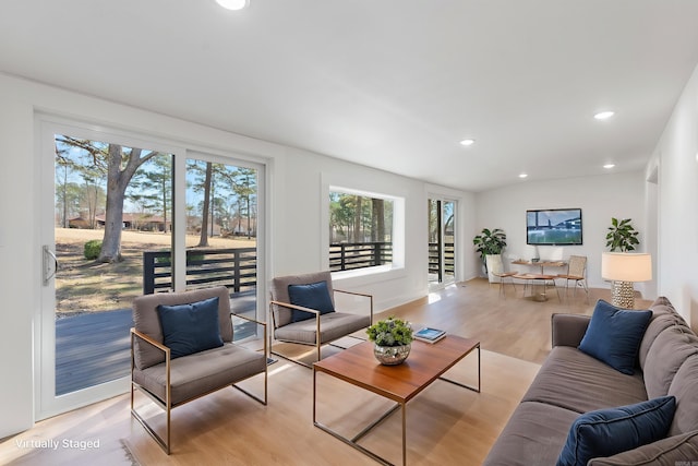 living room featuring recessed lighting and light wood-style floors