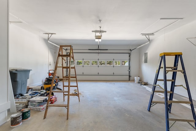 garage with electric panel and baseboards