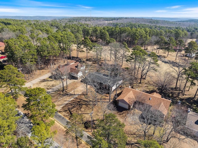 drone / aerial view featuring a forest view