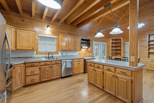 kitchen with a healthy amount of sunlight, appliances with stainless steel finishes, wooden ceiling, light wood-style floors, and a sink