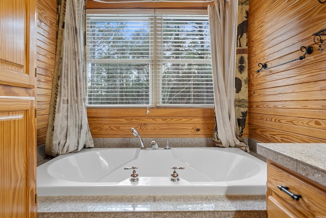 full bath featuring a bath and vanity