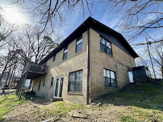 view of side of property with brick siding