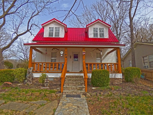 view of front of house with ceiling fan, covered porch, and metal roof