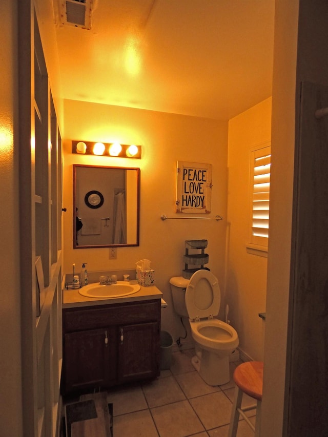 full bath featuring tile patterned floors, toilet, and vanity