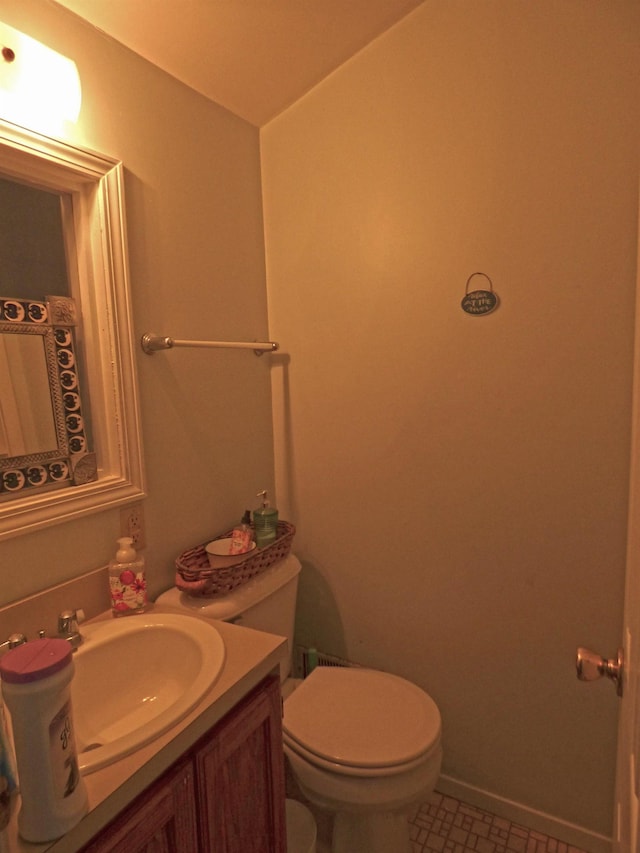 bathroom featuring toilet and vanity