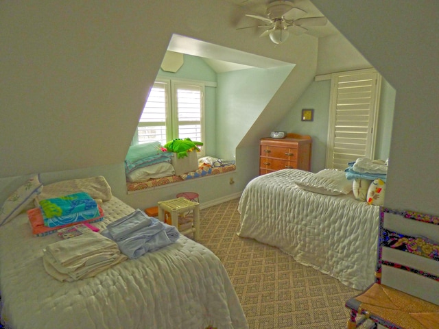 carpeted bedroom with baseboards and lofted ceiling