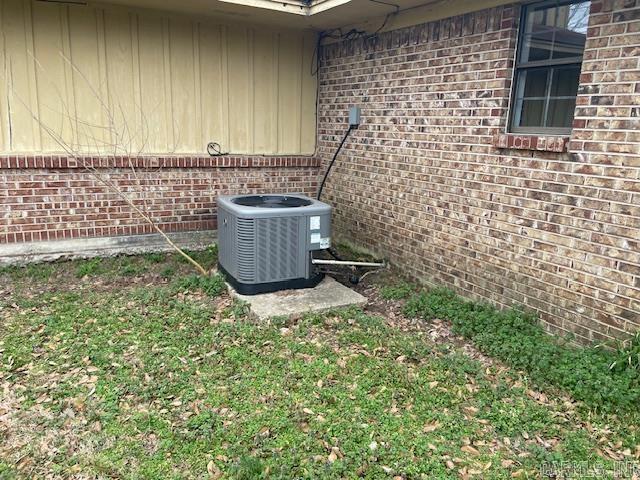 details with brick siding and central air condition unit