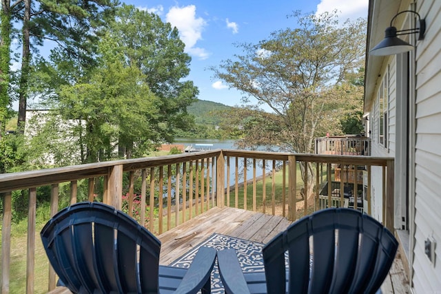 wooden deck featuring a water view