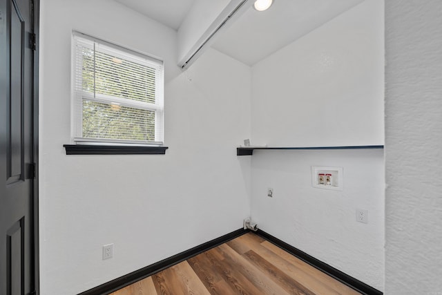 laundry room featuring baseboards, washer hookup, laundry area, dark wood-style floors, and electric dryer hookup