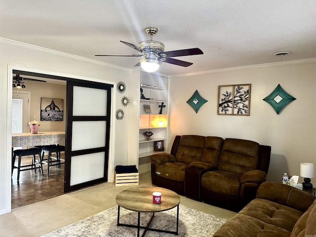 carpeted living room featuring visible vents, ceiling fan, built in features, ornamental molding, and a textured ceiling