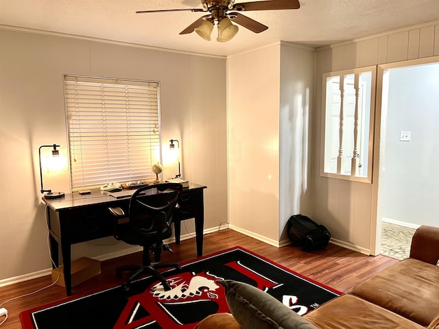 office space with ornamental molding, a textured ceiling, ceiling fan, and wood finished floors