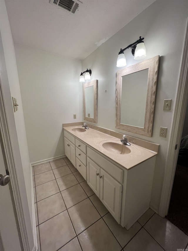 full bathroom featuring tile patterned flooring, visible vents, and a sink