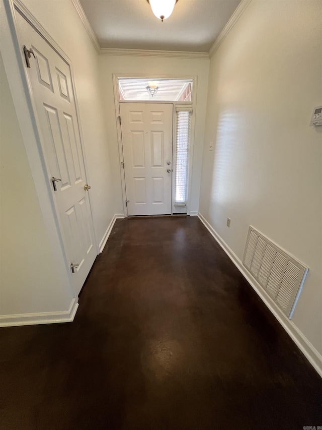 interior space with baseboards, visible vents, and ornamental molding