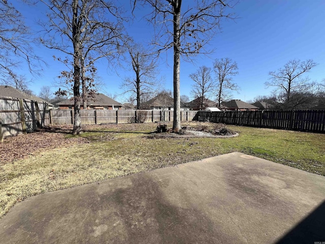 view of yard featuring a patio area and a fenced backyard