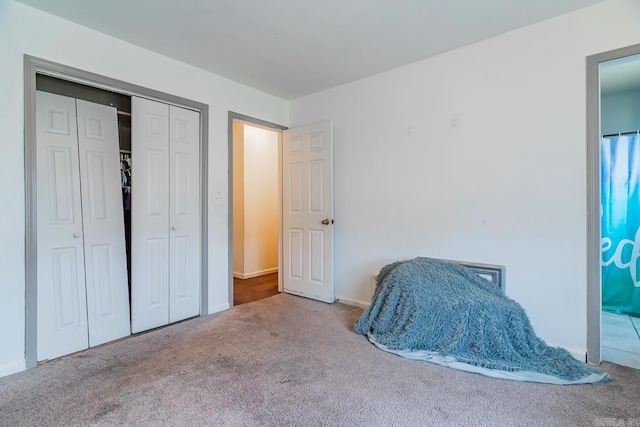 carpeted bedroom with a closet