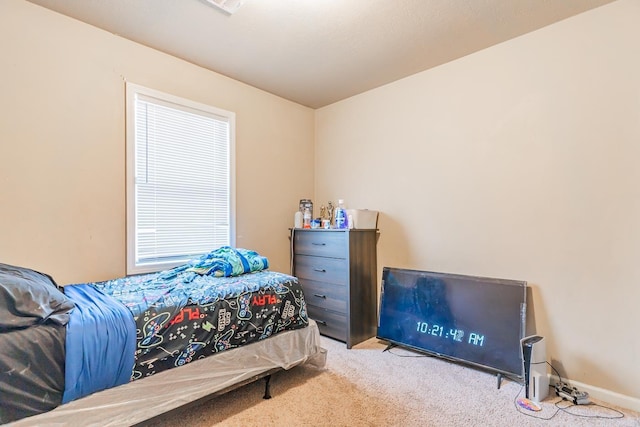 carpeted bedroom with baseboards