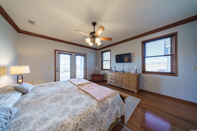 bedroom with baseboards, wood finished floors, visible vents, and ornamental molding