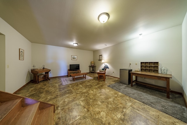 living room featuring baseboards