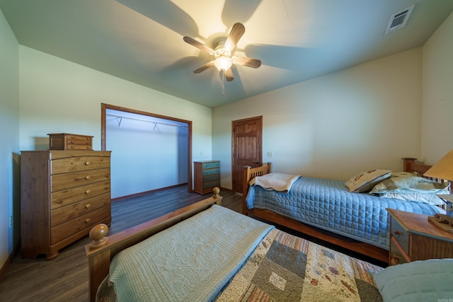 bedroom featuring visible vents, ceiling fan, and wood finished floors