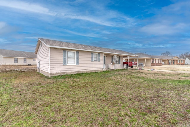 ranch-style house with covered porch and a front yard