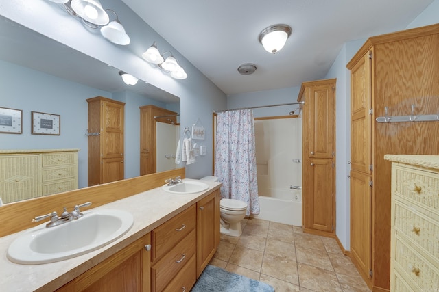 bathroom with a sink, toilet, shower / bath combo, and tile patterned floors