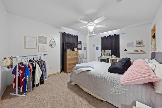 bedroom featuring a ceiling fan, baseboards, and carpet floors