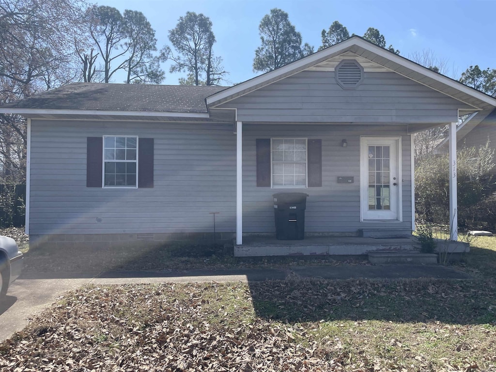 view of front of property with roof with shingles