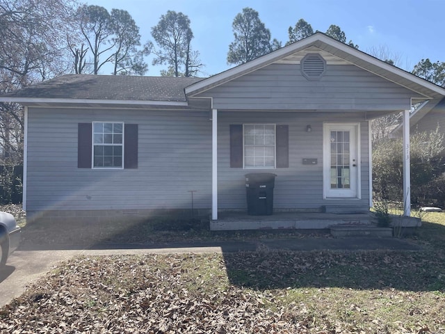 view of front of property with roof with shingles