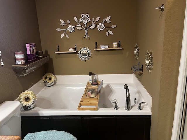 full bathroom with toilet and a whirlpool tub