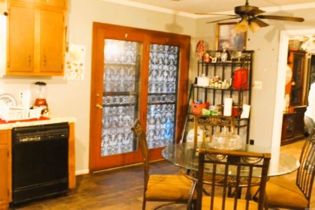 dining area with crown molding, ceiling fan, and dark wood-style flooring