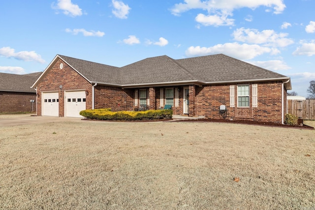 ranch-style home featuring a front lawn, fence, brick siding, and a shingled roof