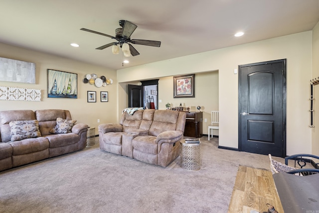 living area with recessed lighting, baseboards, a ceiling fan, and carpet flooring