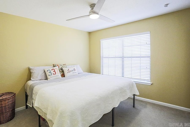 bedroom featuring carpet flooring, a ceiling fan, and baseboards