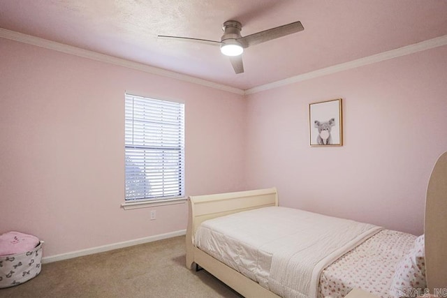 bedroom featuring carpet flooring, ceiling fan, crown molding, and baseboards