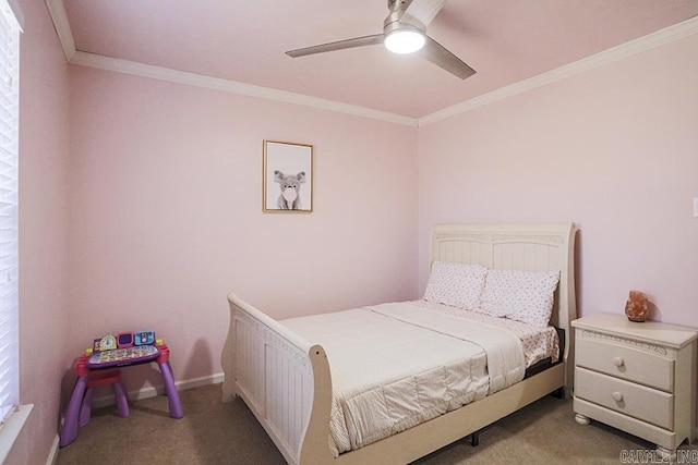 carpeted bedroom with ceiling fan, baseboards, and ornamental molding