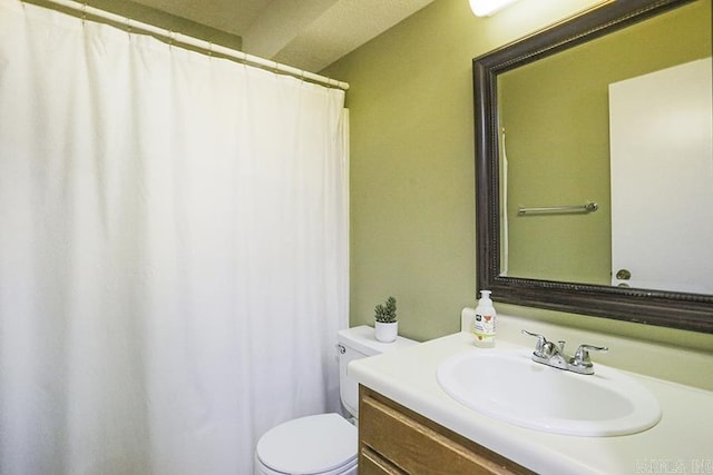 bathroom with a shower with shower curtain, toilet, and vanity